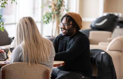 Students relaxing in the College of Nursing lounge area